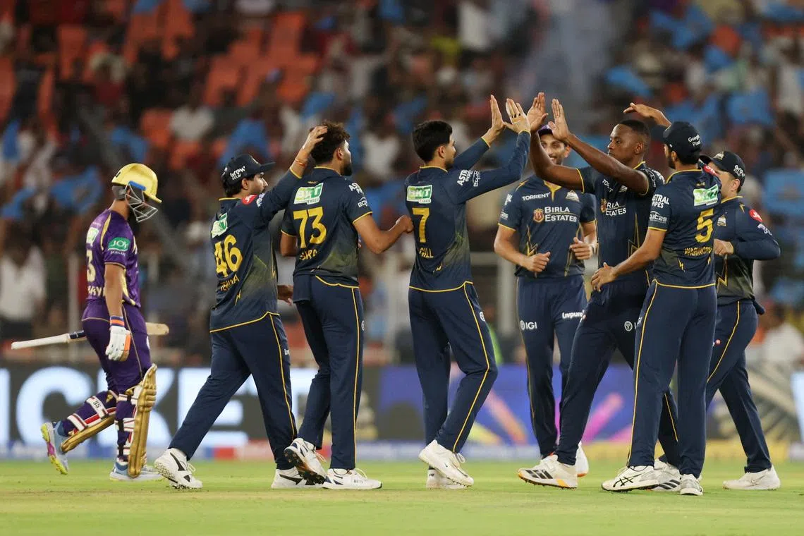 Cricket - Indian Premier League - IPL - Gujarat Titans v Kolkata Knight Riders - Narendra Modi Stadium, Ahmedabad, India - April 17, 2026 Gujarat Titans's Kagiso Rabada celebrates with teammates taking the wicket of  Kolkata Knight Riders' Angkrish Raghuvanshi REUTERS/Amit Dave