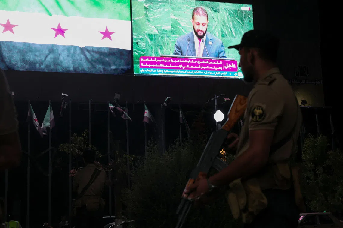 A member of the Syrian security forces stands during President Ahmad al-Sharaa's address at the United Nations General Assembly meeting, in Aleppo, Syria, Septemper 24, 2025. REUTERS/Mahmoud Hassano