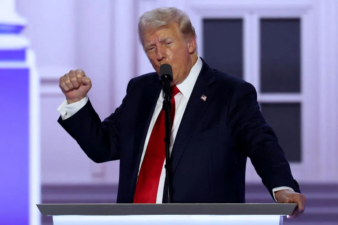 Republican presidential nominee and former U.S. President Donald Trump gestures as he gives his acceptance speech on Day 4 of the Republican National Convention (RNC), at the Fiserv Forum in Milwaukee, Wisconsin, U.S., July 18, 2024. REUTERS/Mike Segar