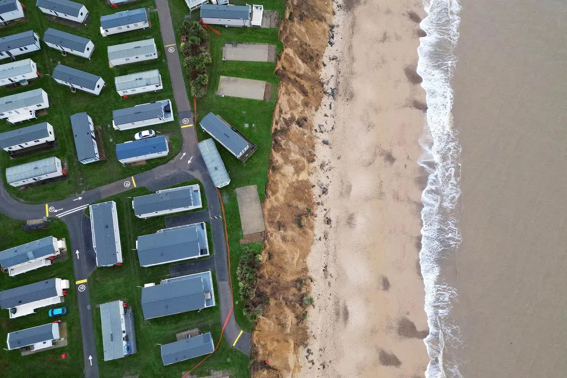 View of the seafront and collapsed road following the erosion caused by high tides and wind at Parkfield Holiday Park in Lowestoft, Britain, Nov 27, 2023. 