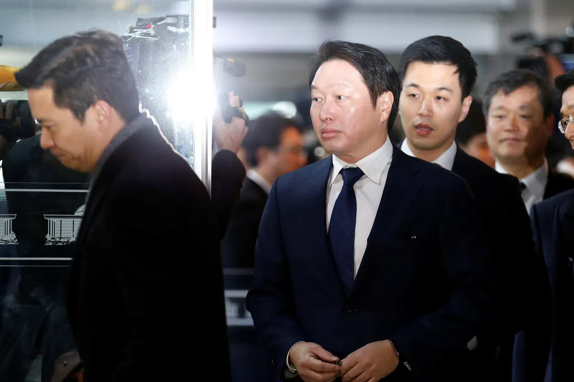 SK Group Chairman Chey Tae-won arrives to attend a hearing at the National Assembly in Seoul, South Korea, December 6, 2016.  REUTERS/Kim Hong-Ji