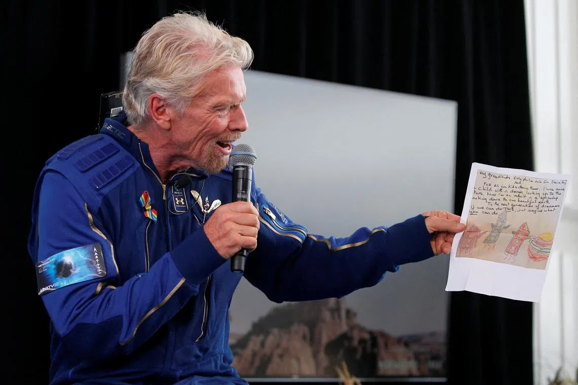 Billionaire entrepreneur Richard Branson speaks at a news conference, after flying with a crew in Virgin Galactic's passenger rocket plane VSS Unity to the edge of space at Spaceport America near Truth or Consequences, New Mexico, U.S., July 11, 2021. REUTERS/Joe Skipper/File Photo