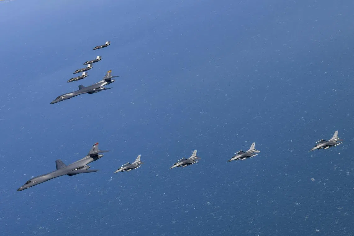 A handout photo made available by the South Korean Defense Ministry shows U.S Air force B-1B and F-16 and South Korea Air Force F-35A aircrafts during a joint air drill after North Korea's missile launch, in South Korea, Feb 19 2023. 