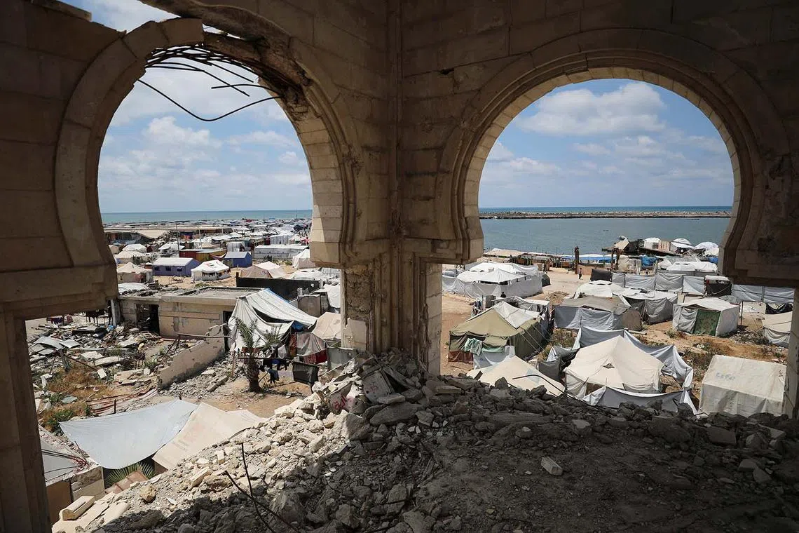 A view from the ruins of a mosque showing tents used by Palestinians displaced by the Israeli military offensive, near Gaza's seaport, in Gaza City, May 22, 2025. 