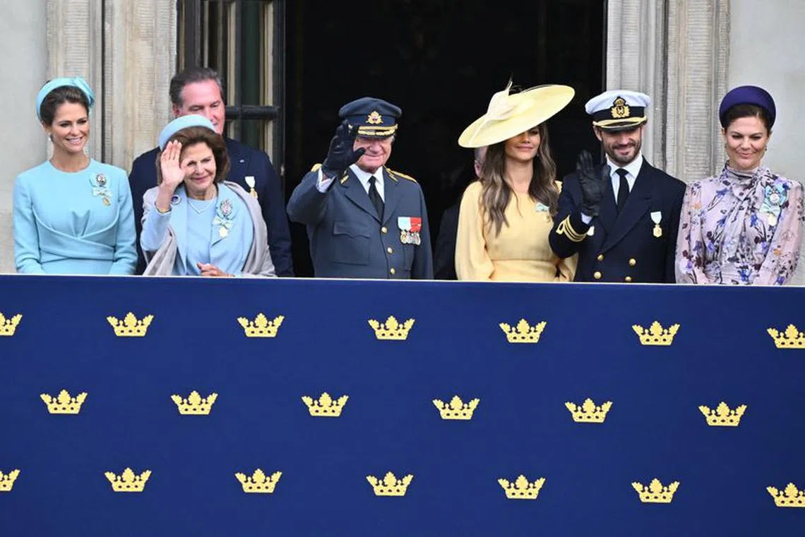Princess Madeleine, Chris O'Neill, Prince Daniel, Sweden's Queen Silvia, Sweden's King Carl Gustaf, Prince Carl Philip, Prince Daniel and Crown Princess Victoria watch from the balcony during the changing of the guard in the outer courtyard of Stockholm Palace on the occasion of King Carl XVI Gustaf's 50th anniversary on the throne, in Stockholm, Sweden, September 15, 2023. TT News Agency/Claudio Bresciani via REUTERS