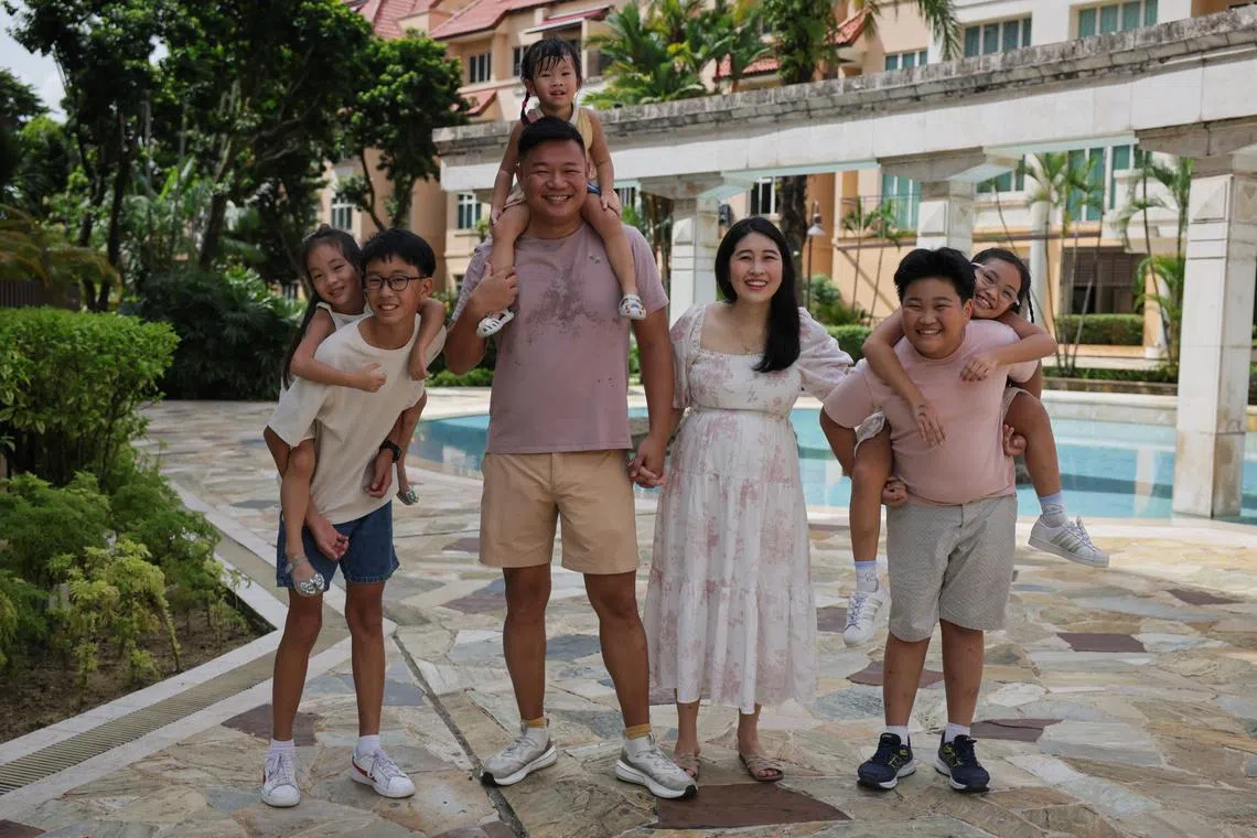 Clement Chua (third from left) and Kelly Ang, 38 (third from right) together with their children.