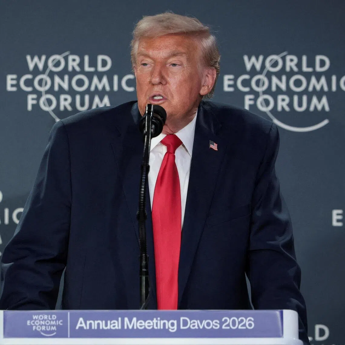 FILE PHOTO: U.S. President Donald Trump speaks during a reception with business leaders at the 56th annual World Economic Forum (WEF), in Davos, Switzerland, January 21, 2026. REUTERS/Jonathan Ernst/File Photo