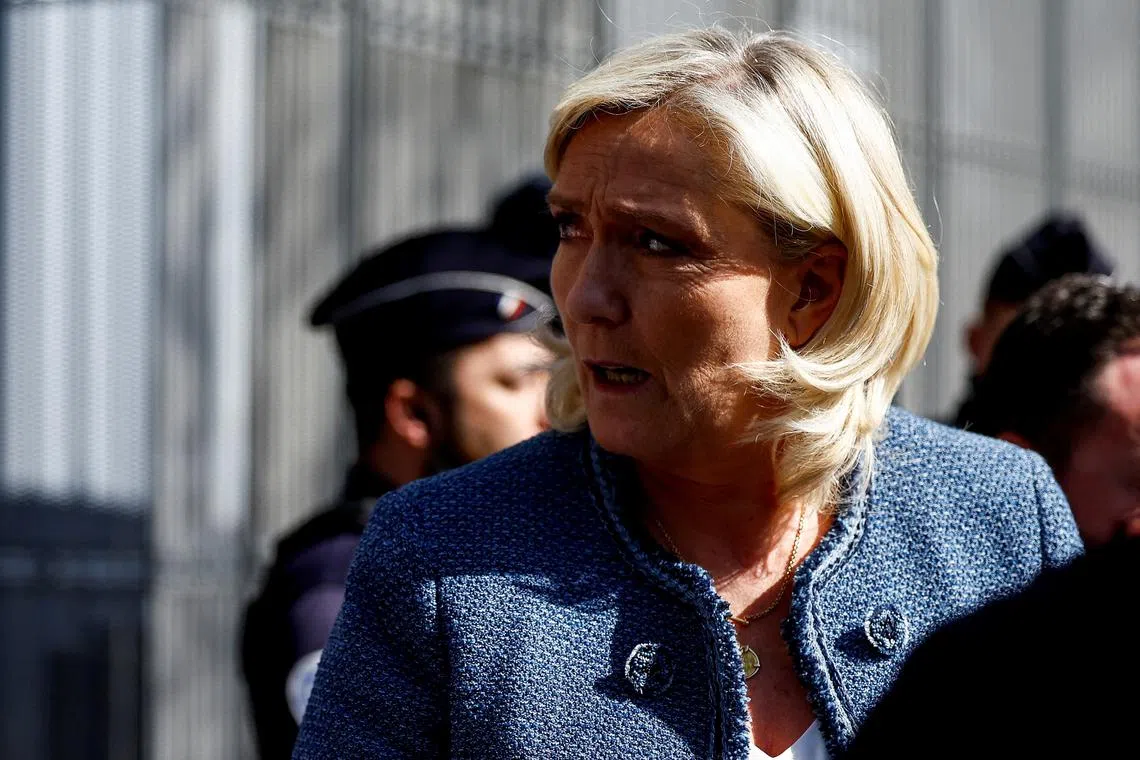 French far-right leader Marine Le Pen, member of parliament from the Rassemblement National (National Rally - RN) party, leaves the courthouse on the day of the verdict of her trial alongside 24 other defendants (party officials and employees, former lawmakers and parliamentary assistants) and the RN party itself, over accusations of misappropriation of European Union funds, in Paris, France, March 31, 2025. REUTERS/Abdul Saboor