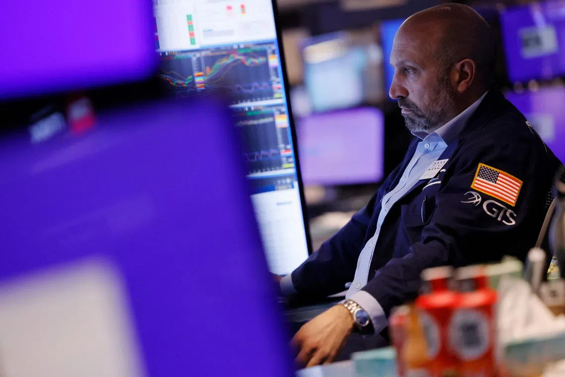Traders work on the floor of the New York Stock Exchange.