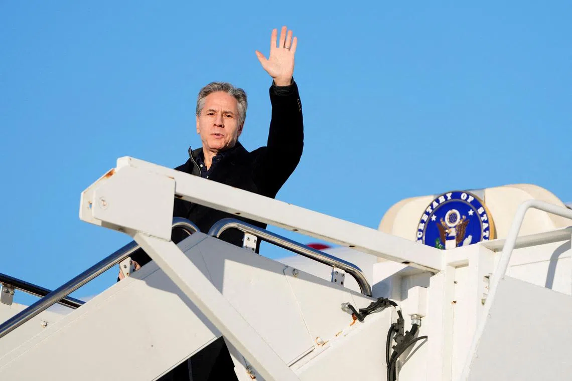 U.S. Secretary of State Antony Blinken waves as he boards a plane, en route to Saudi Arabia, as part of his fifth urgent trip to the Middle East since the war between Israel and the Palestinian Islamist group Hamas in Gaza erupted in October, at Joint Base Andrews, in Maryland, U.S., February 4, 2024. Mark Schiefelbein/Pool via REUTERS