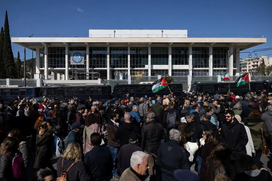 Protesters march outside the U.S. Embassy during an anti-war demonstration following strikes on Iran, in Athens, Greece, March 1, 2026. REUTERS/Stelios Misinas