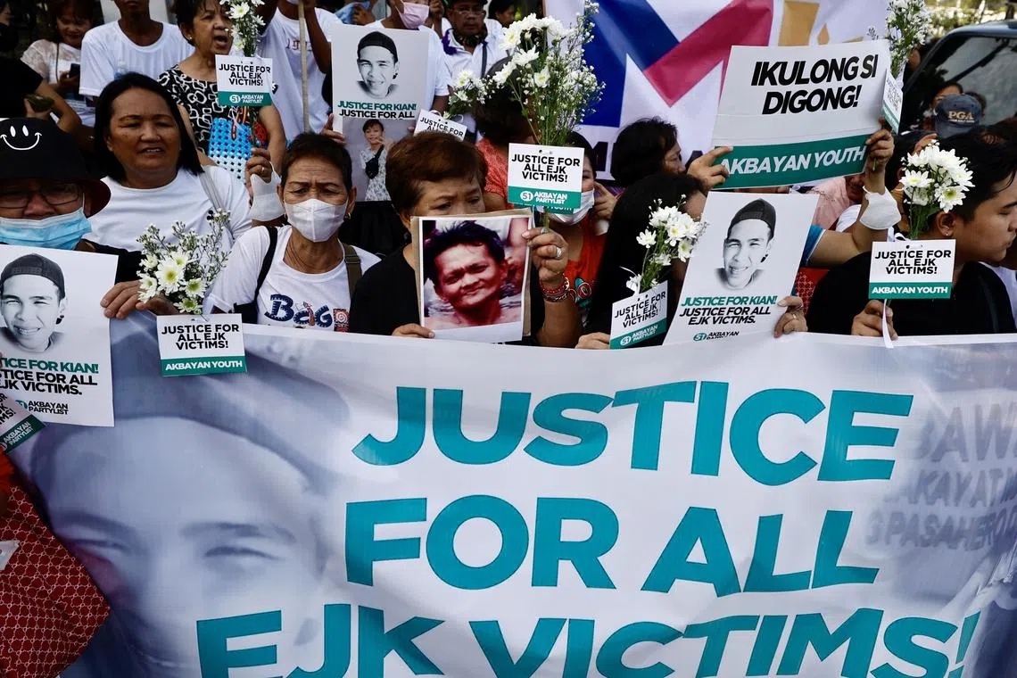 Relatives of those killed in former president Rodrigo Duterte’s bloody drug war demand justice outside the Senate.