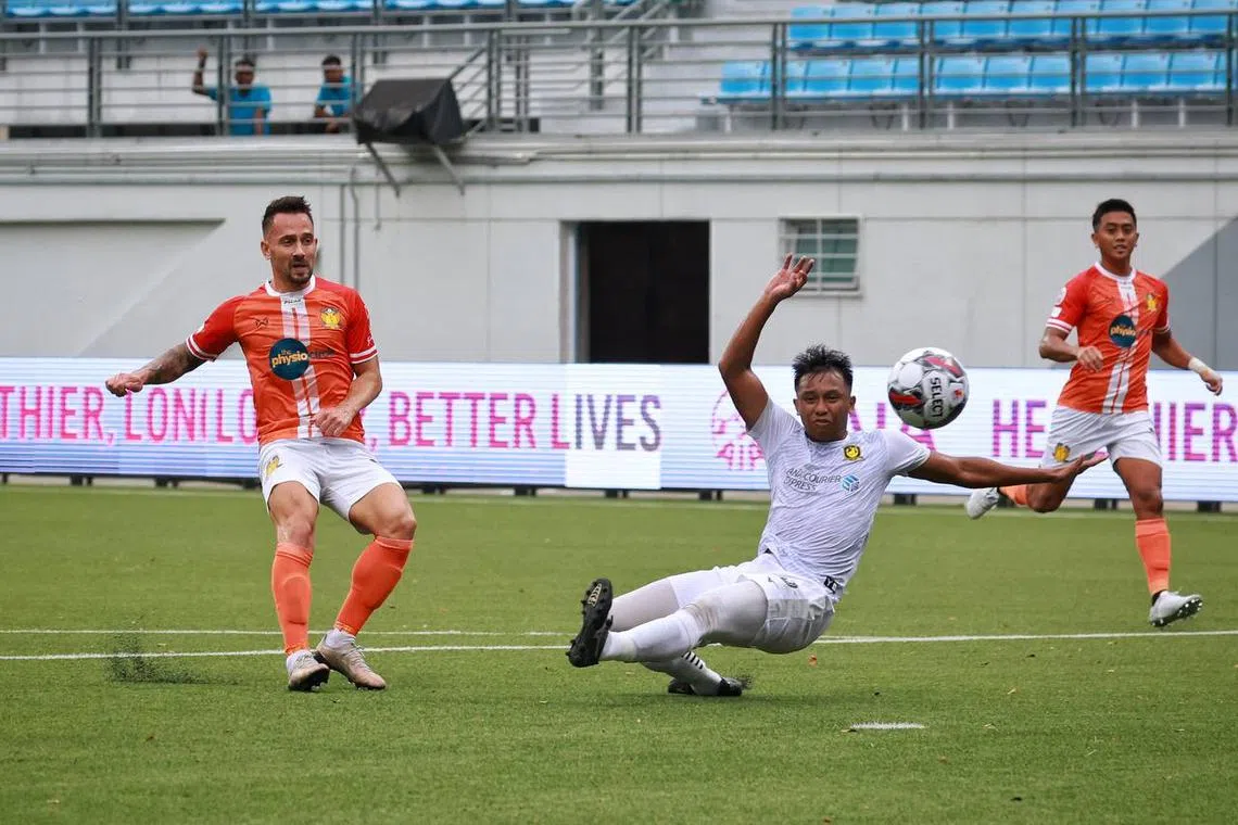 Kristijan Krajcek (left) scoring the opening goal for Hougang during the Singapore Cup final against Tampines.