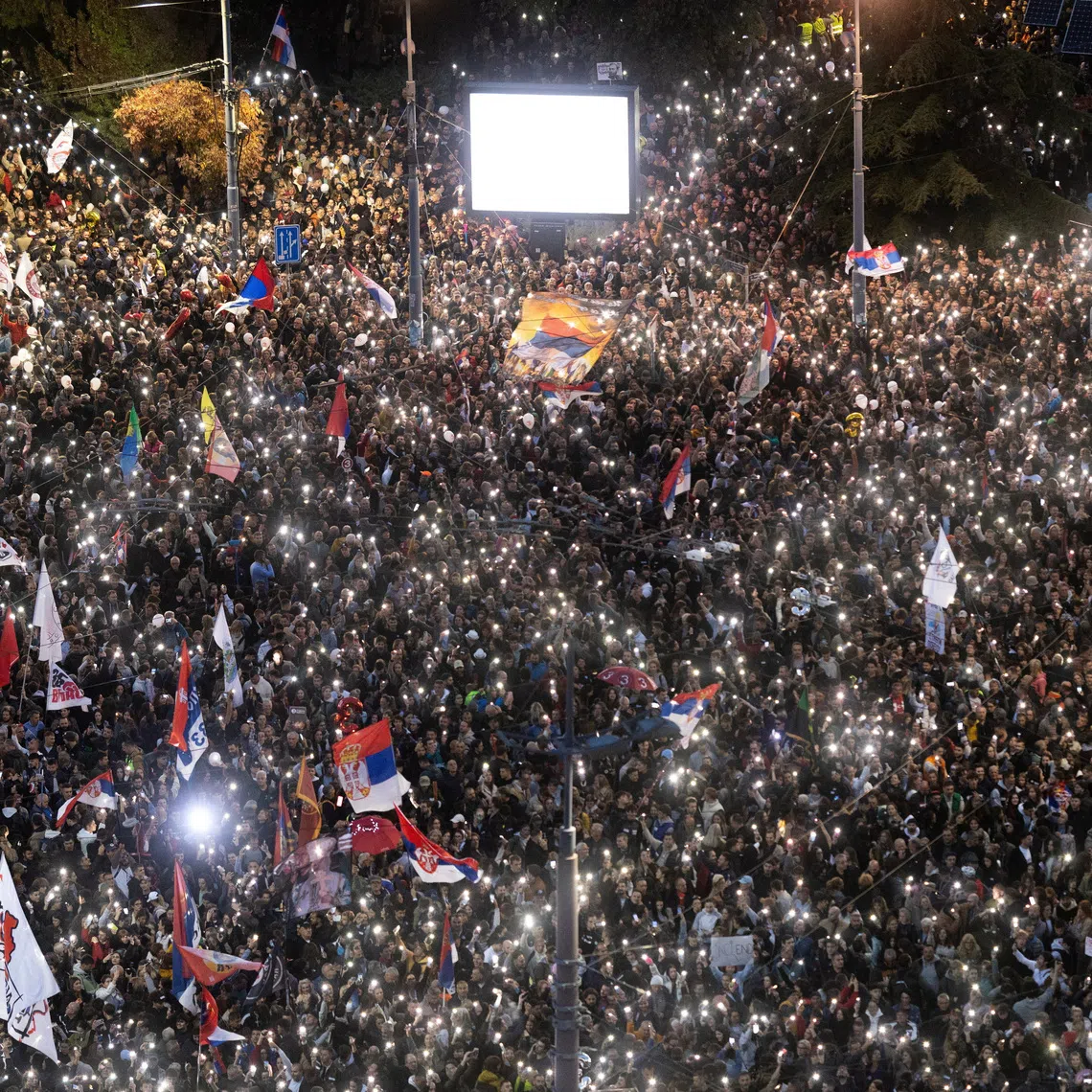 Supporters of the electoral list “Student List - Students Win” attend a final campaign rally at Slavija Square in Belgrade, Serbia, on Oct 22.