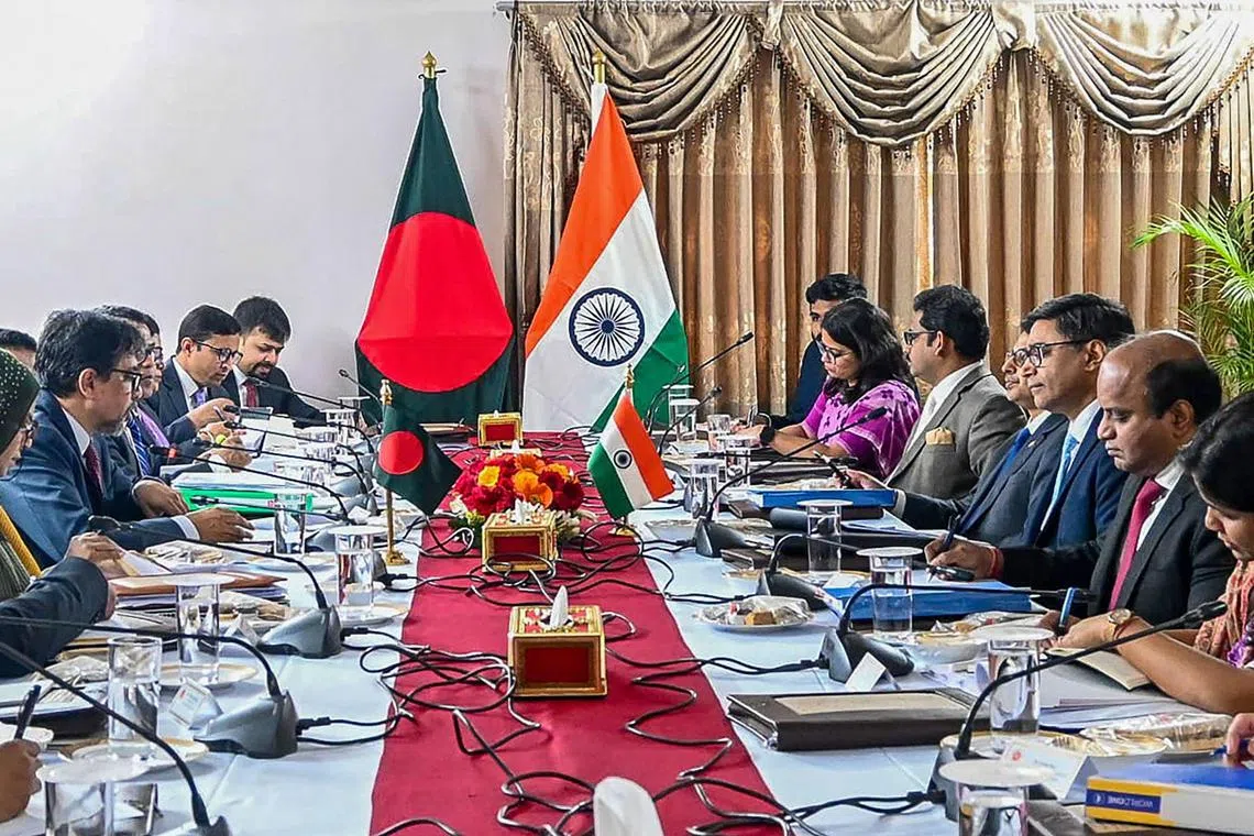 India's foreign secretary Vikram Misri (3R) and his Bangladesh's counterpart Mohammad Jashim Uddin (2L) met at a meeting in Dhaka on Dec 9. . 