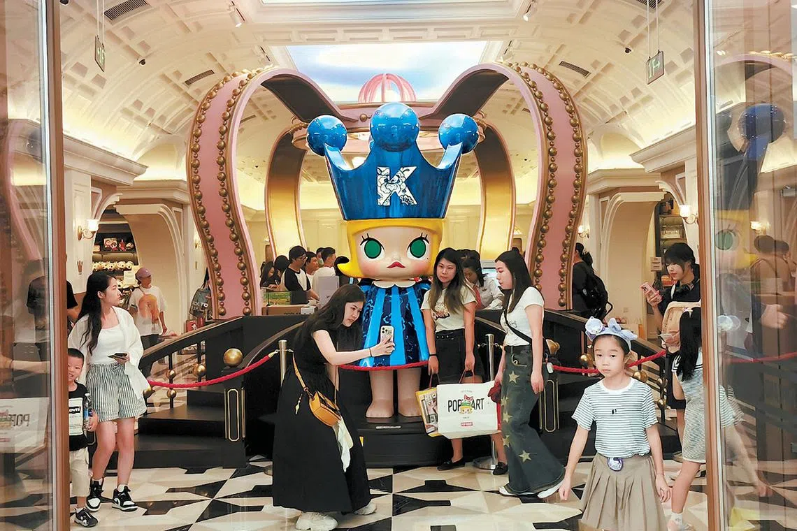 Visitors gather at Pop Land, Pop Mart's first theme park in Beijing. 