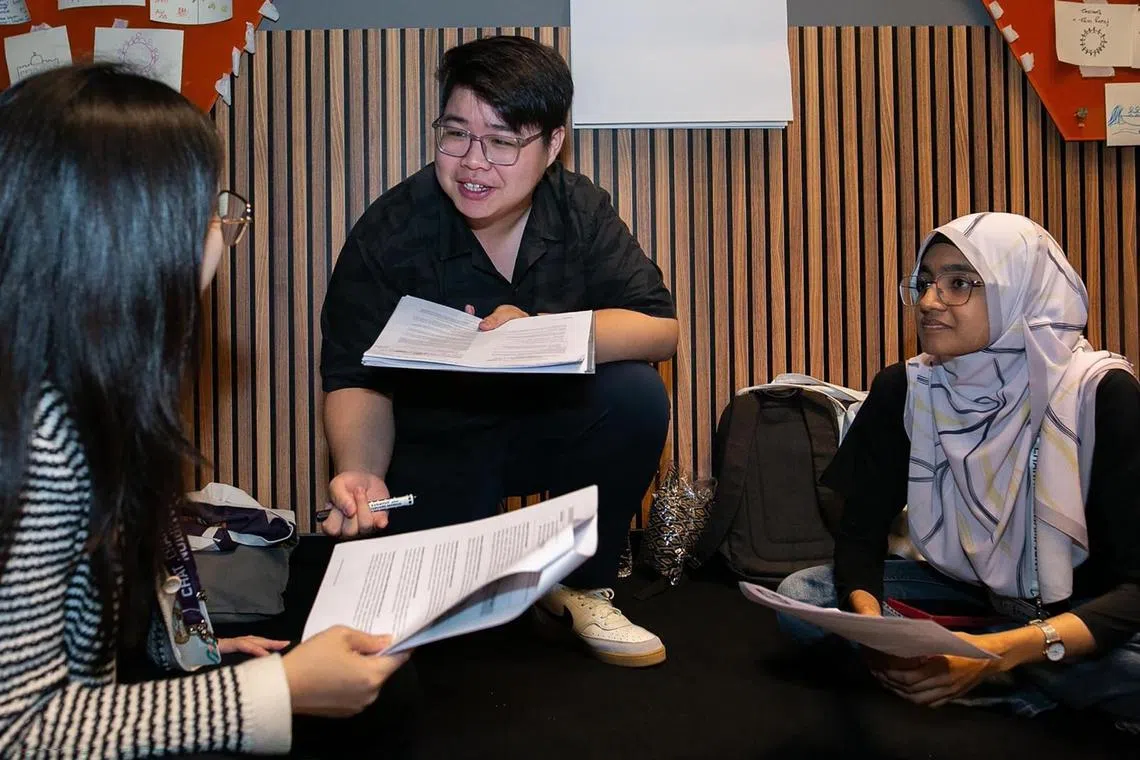 Mr Jalen Goh (centre) was one of the facilitators at the YLCha3 Dialogue Event., teaching students how to chat effectively.  

PHOTO: COURTESY OF ROSES OF PEACE