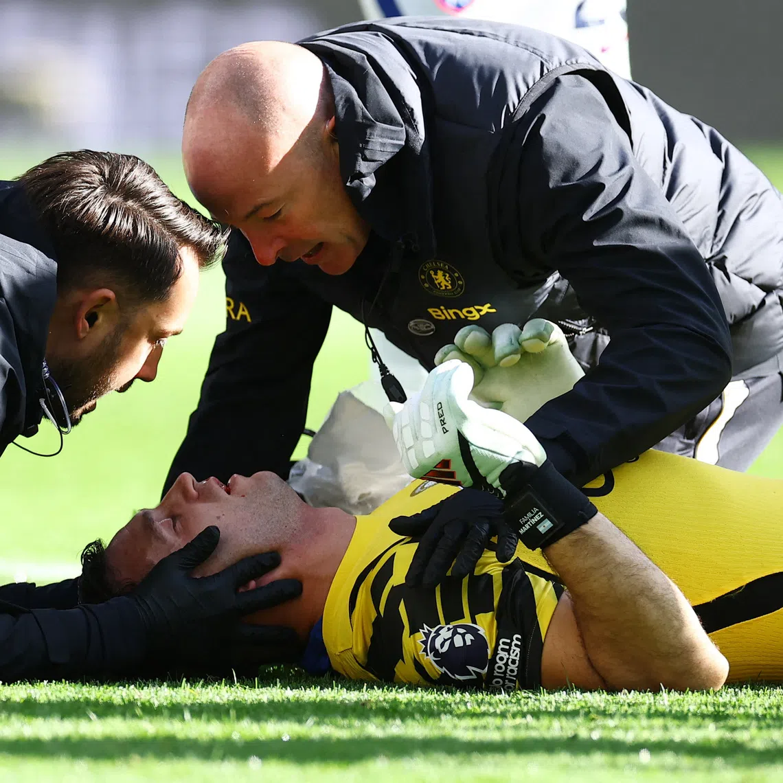 FILE PHOTO: Chelsea's Emiliano Martinez receives medical attention after sustaining an injury at Hill Dickinson Stadium, Liverpool, Britain on October 17, 2026. REUTERS/Phil Noble/File Photo