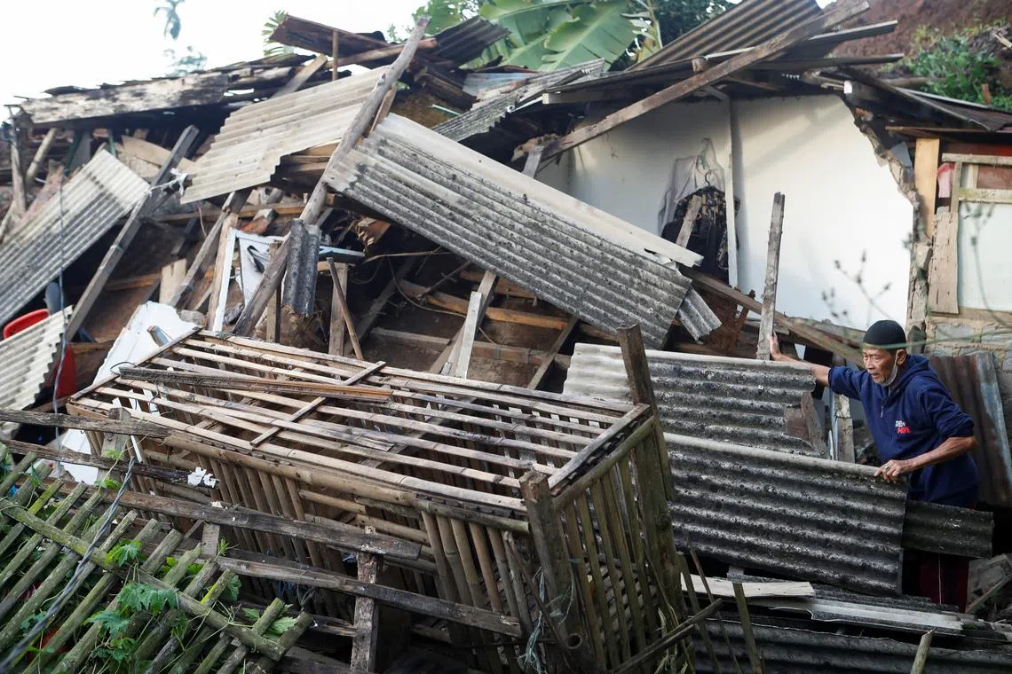 An elderly man stands near his destroyed house, after an earthquake in Cugenang, Cianjur, West Java province, Indonesia, Nov 22, 2022. 