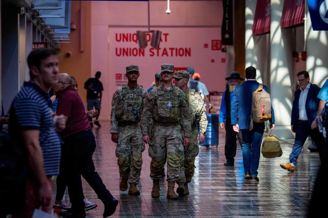 Armed members of the US National Guard patrolling Union Station in Washington on Aug 27.