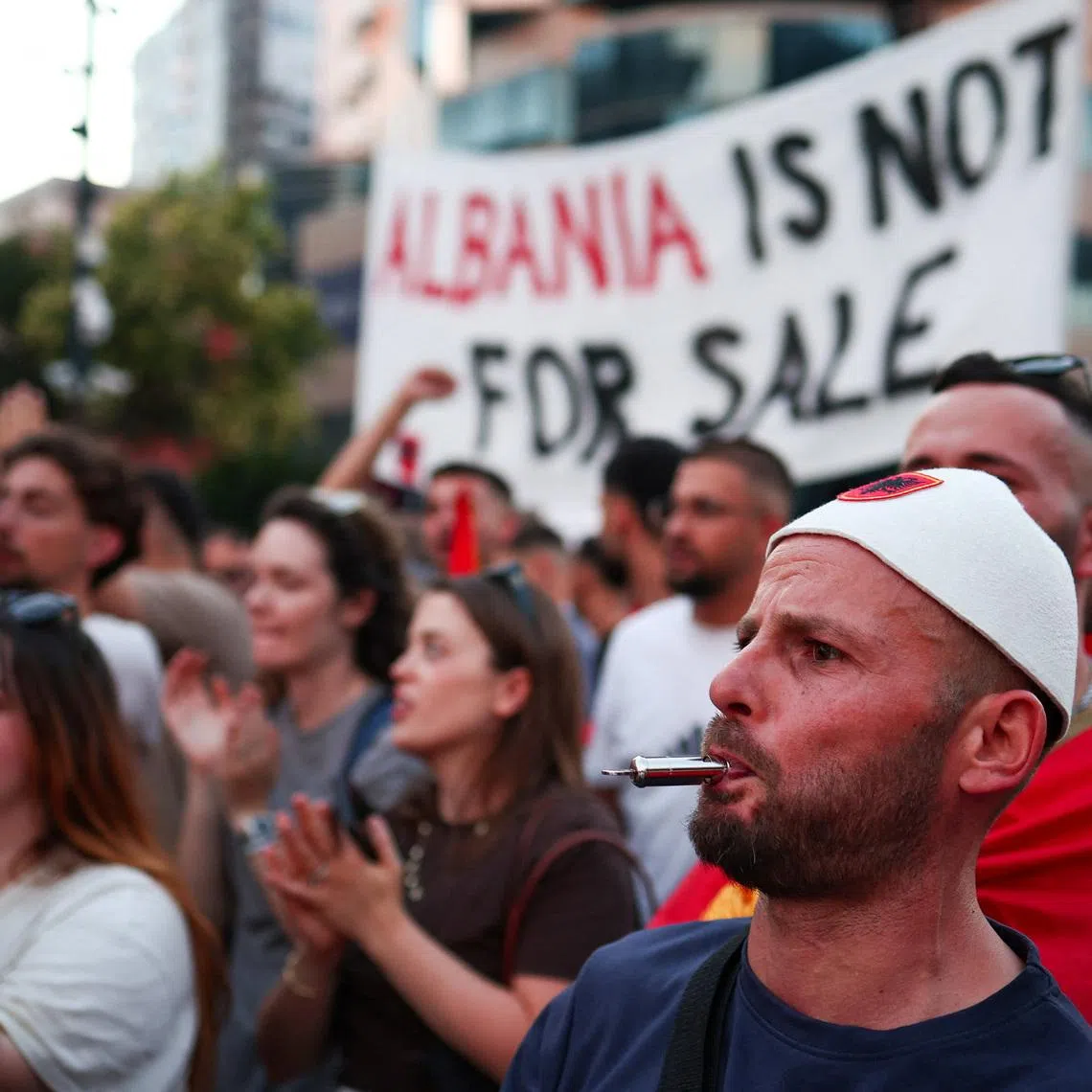 People take part in a protest against a luxury resort, a plan by a company linked to U.S. President Donald Trump's son-in-law, Jared Kushner, on an environmentally sensitive part of the Adriatic coast, in Tirana, Albania, June 10, 2026. REUTERS/Florion Goga