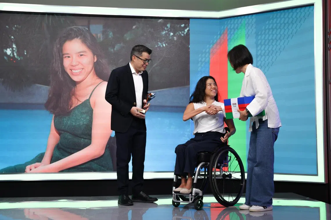 Para swimmer Yip Pin Xiu (centre) receiving the ST Athlete of the Year award from ST Editor Jaime Ho (left) and F&N Foods managing director Jennifer See.