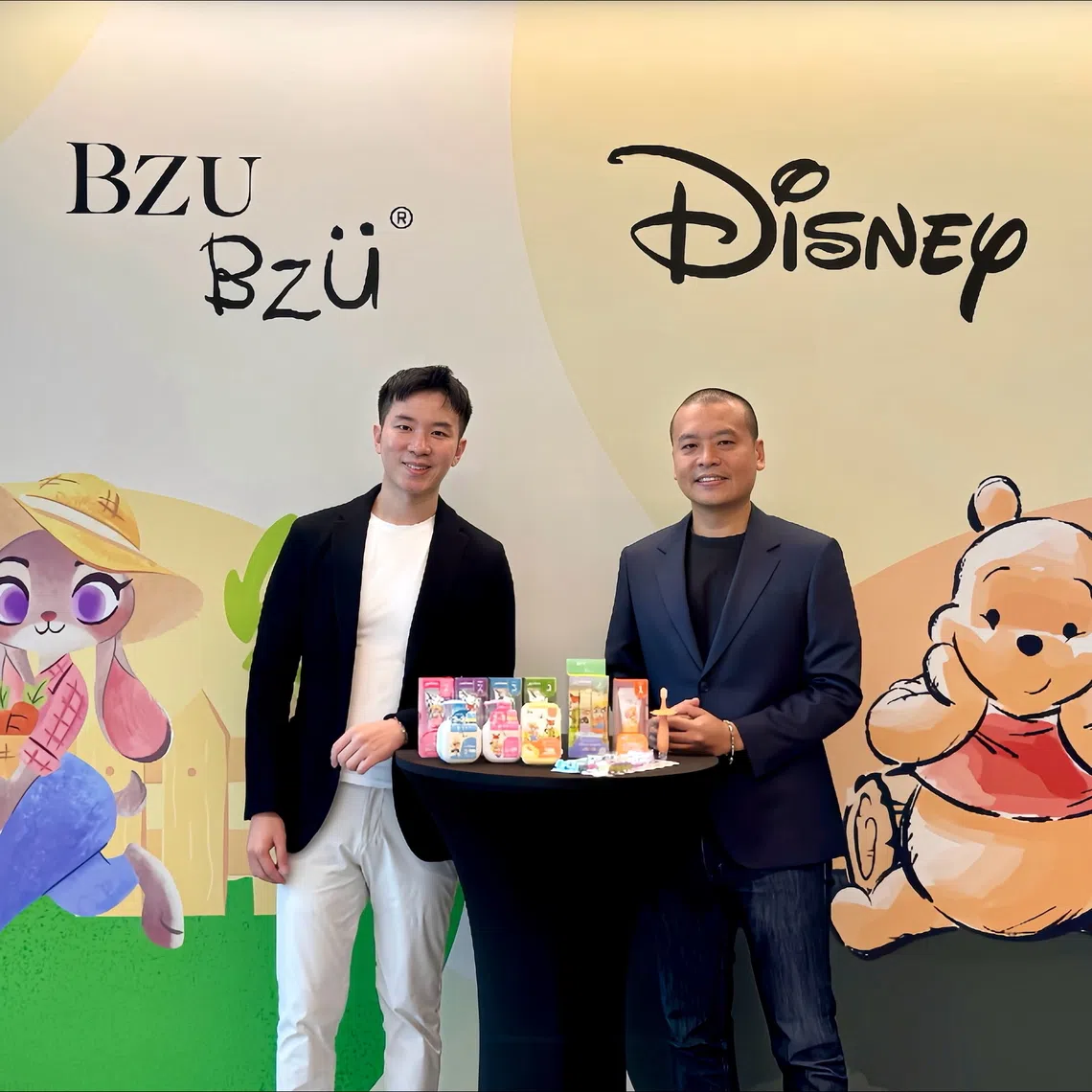 Mr Raphael Jiang (left), Chief Executive Officer and Co-founder of BZU BZU, and Mr Tan Wee, Director, Disney Consumer Products, South Asia Pacific, with BZU BZU’s new children’s oral care range featuring Disney’s Zootopia and Winnie the Pooh. 