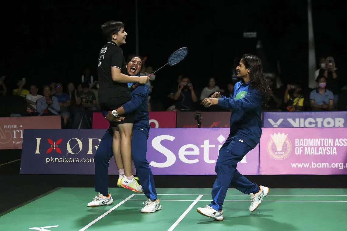 India's Anmol Kharb gets a lift during celebrations after she defeated Thailand's Pornpicha Choeikeewong to help her country win the women's final at the Badminton Asia Team Championships in Shah Alam, Malaysia, on Feb 18.
