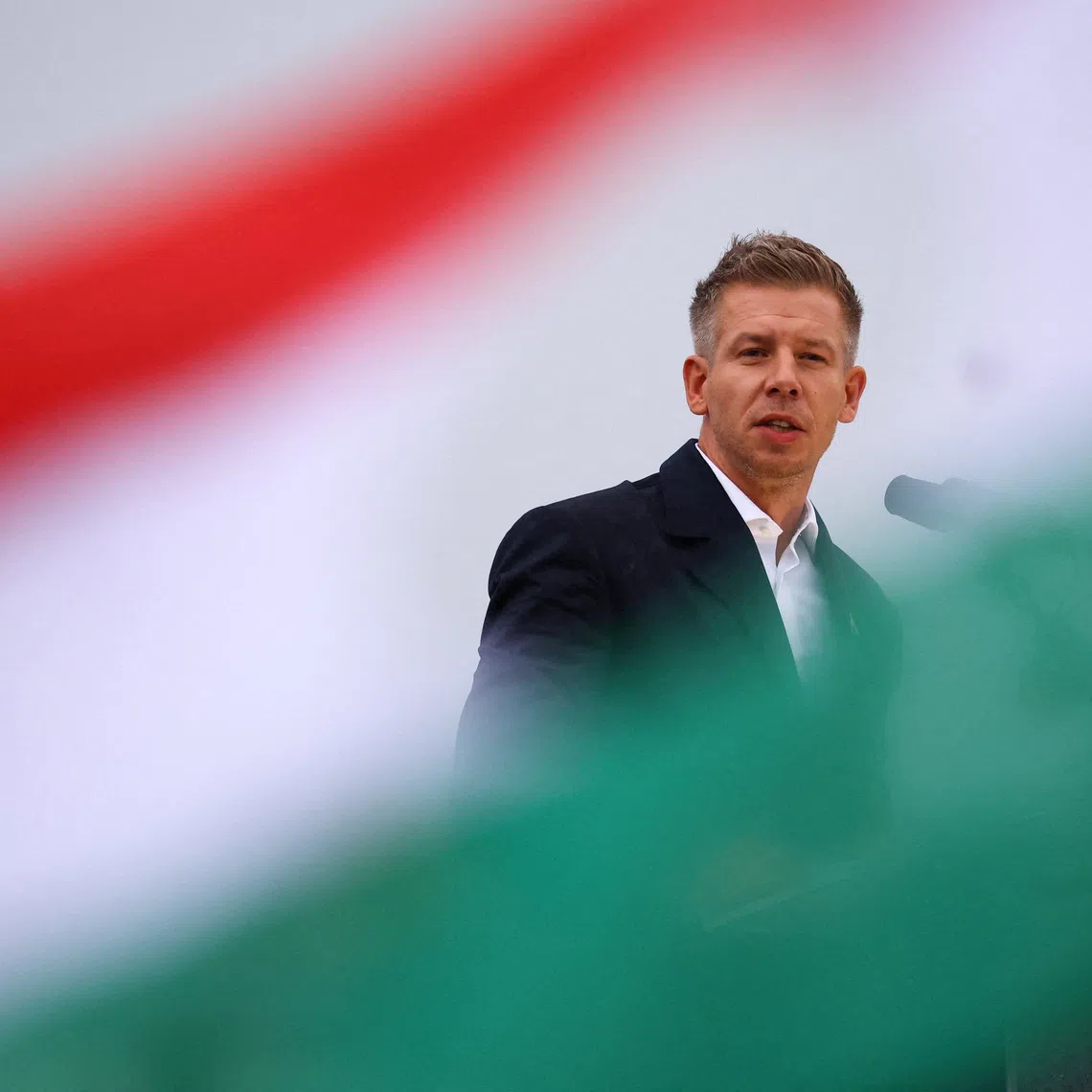 Peter Magyar, leader of the opposition TISZA party, delivers a speech to mark the 69th anniversary of the Hungarian Uprising of 1956, in Budapest, Hungary, October 23, 2025. REUTERS/Bernadett Szabo/File Photo