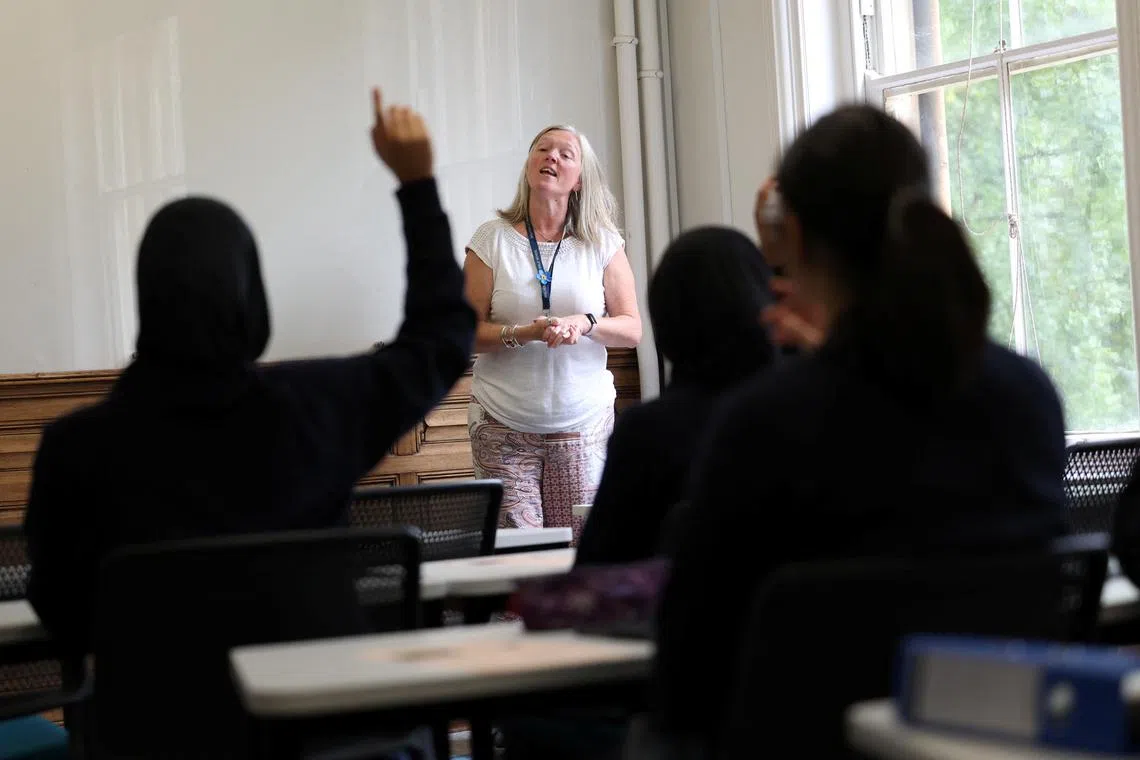 Nearly a fifth of pupils in England were “persistently absent” from school, according to an annual report by Britain's education watchdog.