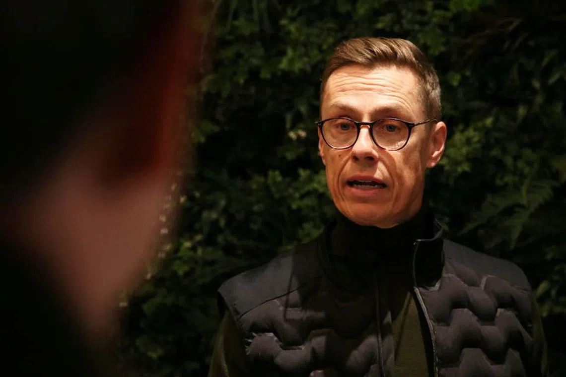 Finnish presidential election candidate Alexander Stubb of the National Coalition Party talks to members of the media before a campaign event in Espoo, Finland, February 10, 2024. REUTERS/Tom Little