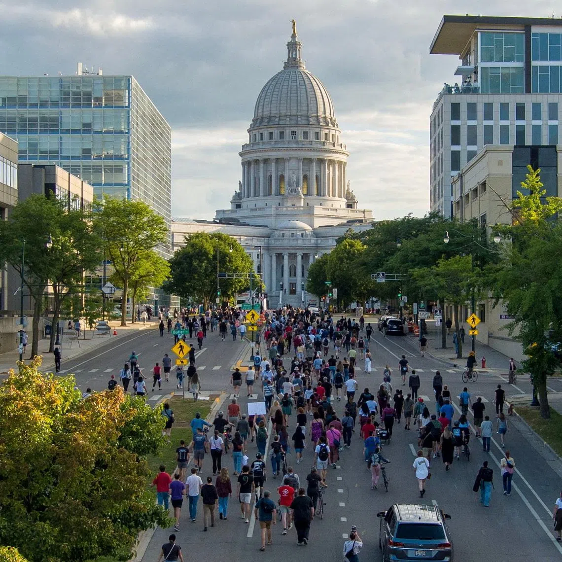 People march in protest to the Wisconsin State Capitol in response to a Madison police officer shooting and killing a man who police reported to be carrying a knife on the city’s near east side, in Madison, Wisconsin, on July 22.