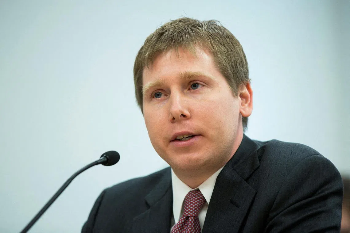 FILE PHOTO: Bitcoin investor Barry Silbert speaks at a New York State Department of Financial Services (DFS) virtual currency hearing in the Manhattan borough of New York January 28, 2014. REUTERS/Lucas Jackson/File Photo