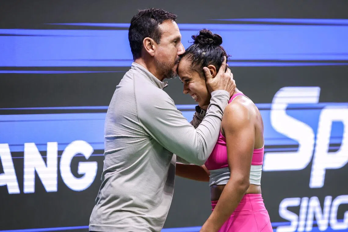 World No. 31 Leylah Fernandez celebrates with her father and coach Jorge Fernandez after winning the Singapore Tennis Open.