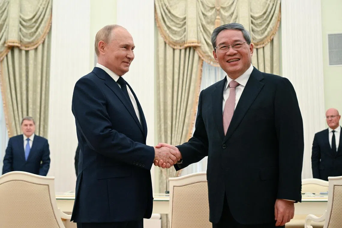 Russia's President Vladimir Putin and China's Premier Li Qiang met in Moscow on Aug 21.
