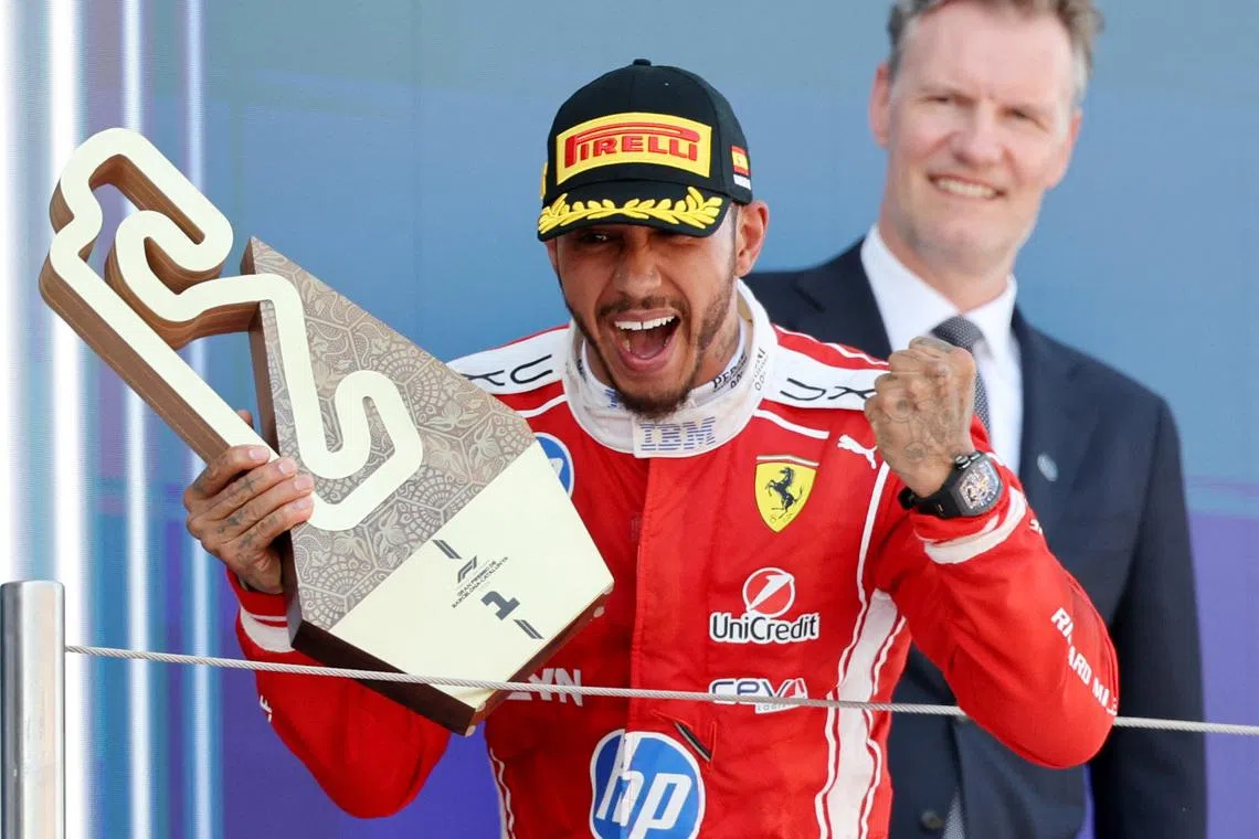 Formula One F1 - Barcelona-Catalunya Grand Prix - Circuit de Barcelona-Catalunya, Barcelona, Spain - June 14, 2026 Ferrari's Lewis Hamilton celebrates with a trophy after winning the Barcelona-Catalunya Grand Prix REUTERS/Nacho Doce