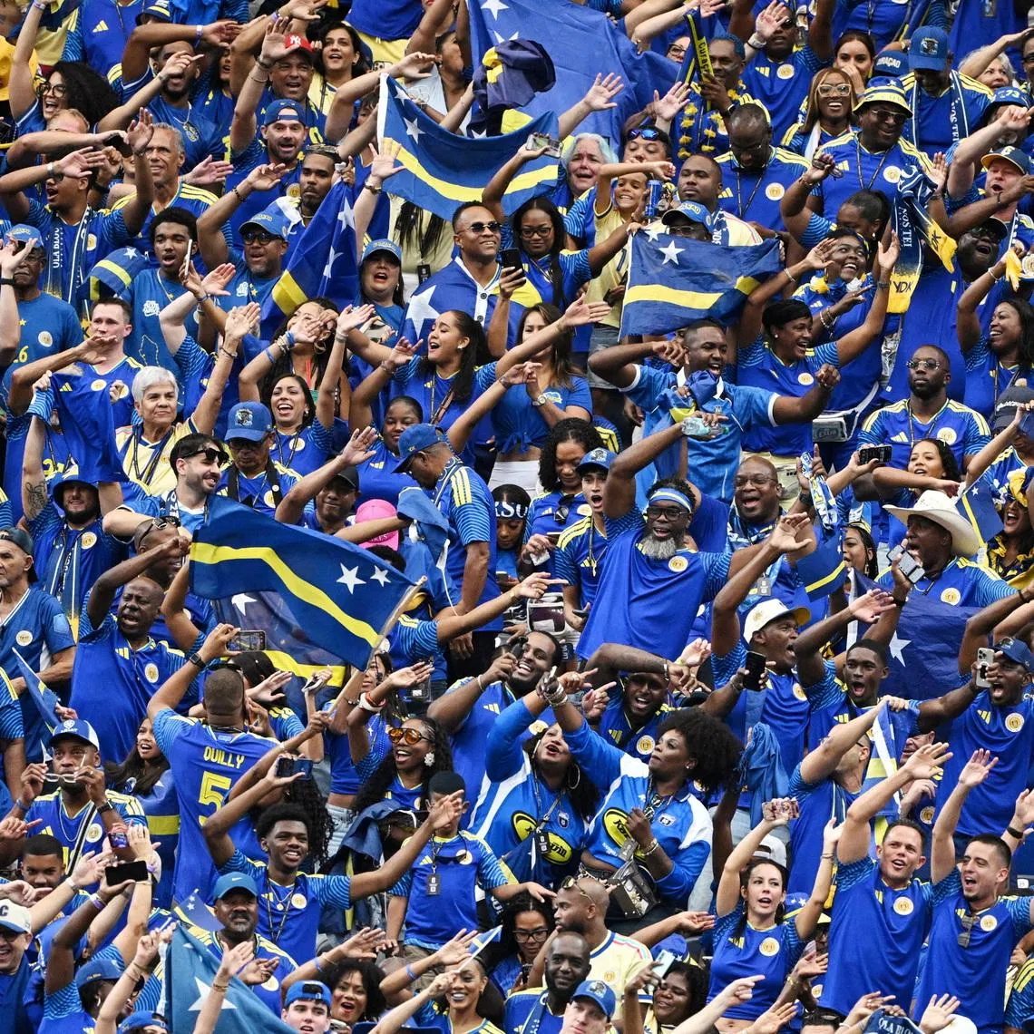 Soccer Football - FIFA World Cup 2026 - Group E - Germany v Curacao - Houston Stadium, Houston, Texas, U.S. - June 14, 2026 Curacao fans celebrate their first goal, scored by Livano Comenencia REUTERS/Annegret Hilse