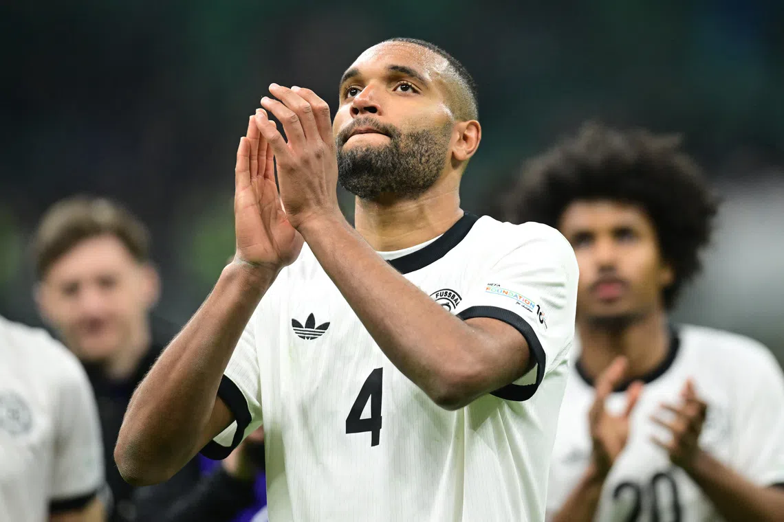 Soccer Football - Nations League - Quarter Final - First Leg - Italy v Germany - San Siro, Milan, Italy - March 20, 2025 Germany's Jonathan Tah celebrates after the match REUTERS/Daniele Mascolo