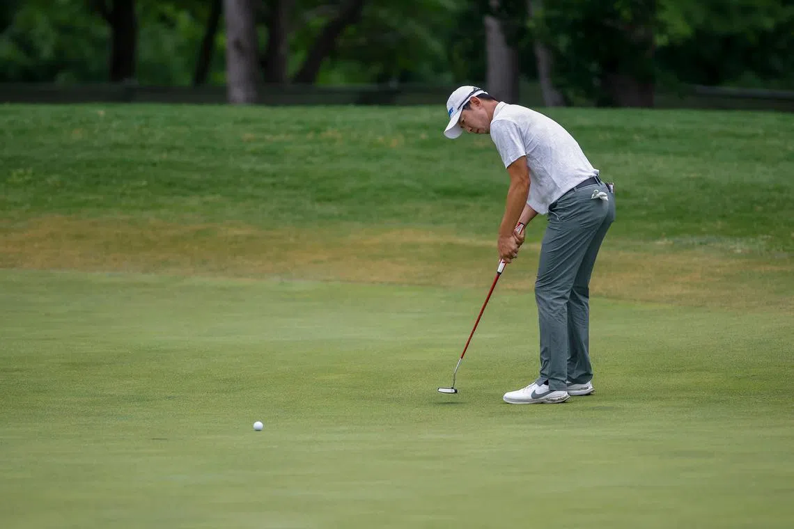 Noh Seung-yul putts for birdie on the 15th green during the first round of the AT&T Byron Nelson.