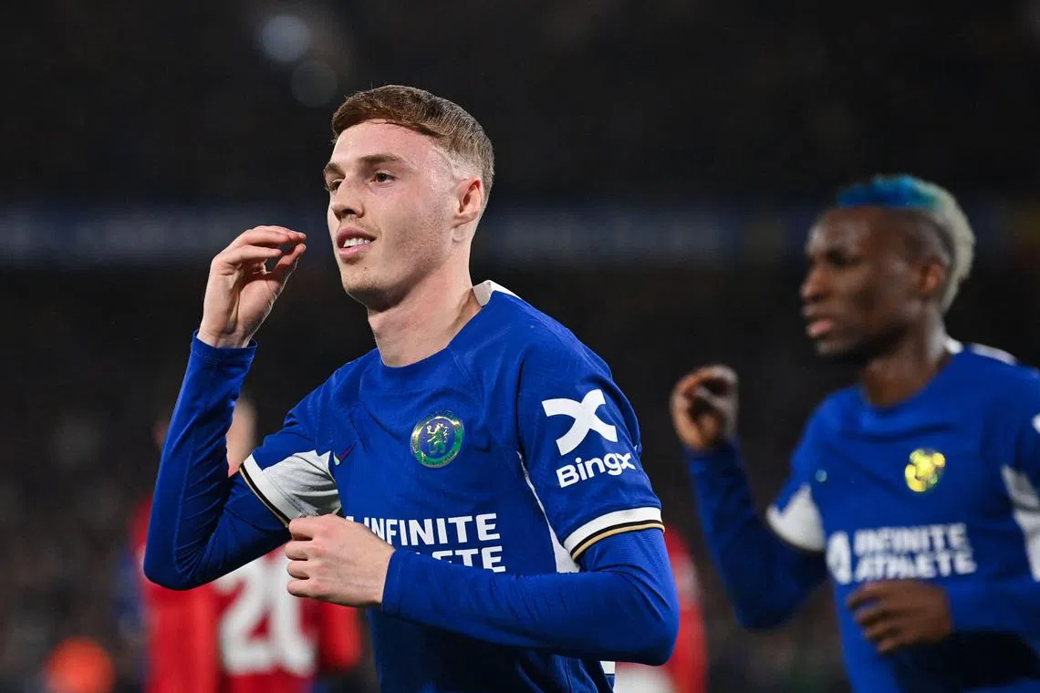 Chelsea midfielder Cole Palmer celebrating after scoring his team's second goal against Manchester United.