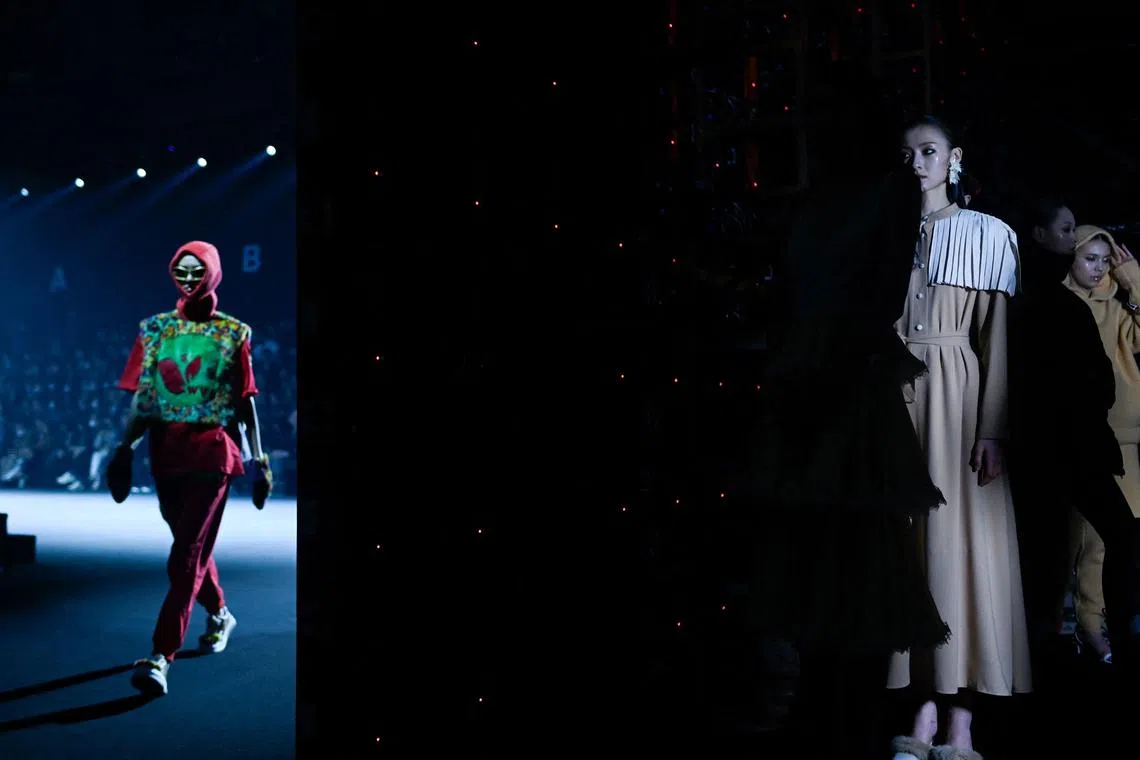 Models wait backstage before presenting creations during the opening ceremony of China Fashion Week in Beijing on March 24.