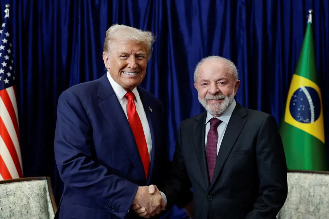 U.S. President Donald Trump and Brazilian President Luiz Inacio Lula da Silva shake hands as they meet on the sidelines of the 47th Association of Southeast Asian Nations (ASEAN) summit in Kuala Lumpur, Malaysia, October 26, 2025. Ricardo Stuckert/Brazil Presidency/Handout via REUTERS
