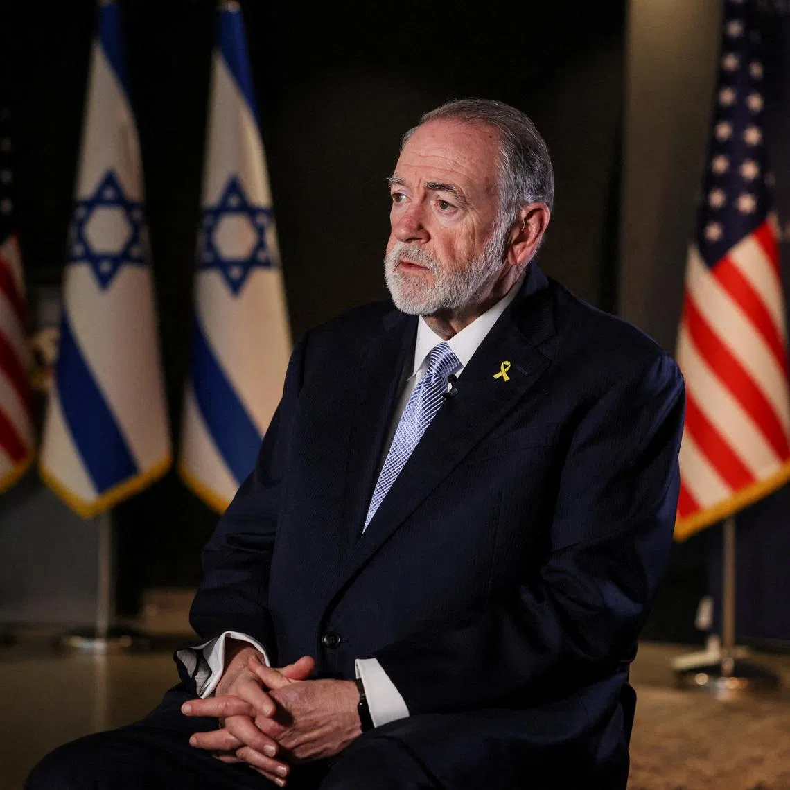 FILE PHOTO: U.S. Ambassador to Israel Mike Huckabee looks on during an interview with Reuters in Jerusalem, September 10, 2025. REUTERS/Ronen Zvulun/File Photo