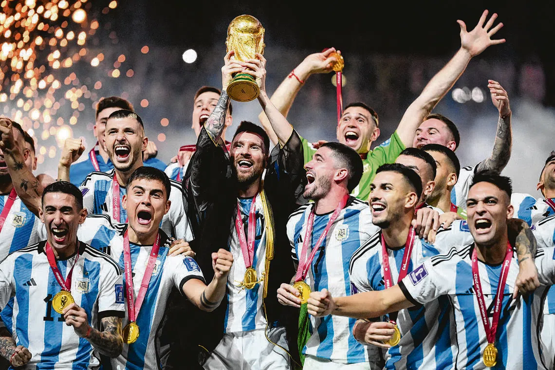 Argentina’s forward Lionel Messi lifts the trophy during the Qatar 2022 World Cup.