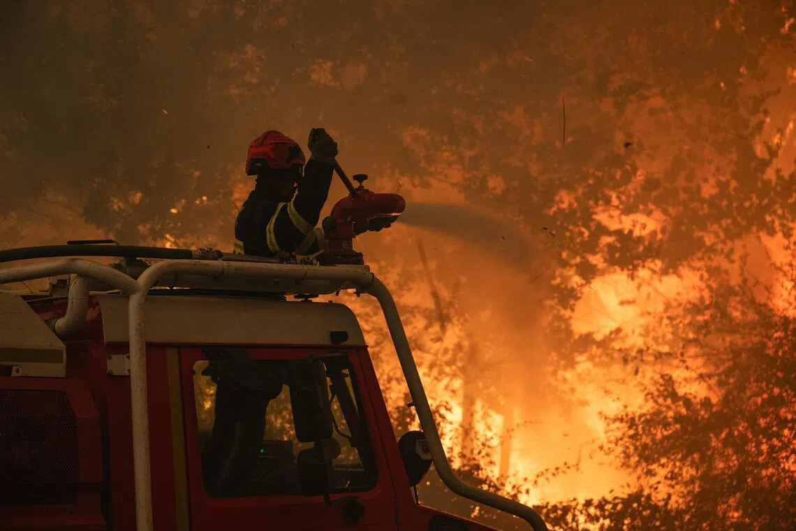Untamed wildfires in Spain, France force more than 200,000 to flee