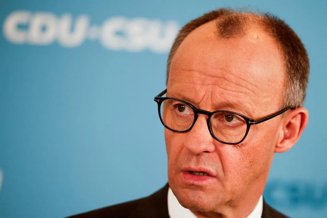 FILE PHOTO: German Chancellor-in-waiting Friedrich Merz speaks to the media after he reached an agreement with the Greens on a massive increase in state borrowing just days ahead of a parliamentary vote next week, in Berlin, Germany, March 14, 2025. REUTERS/Axel Schmidt/File Photo