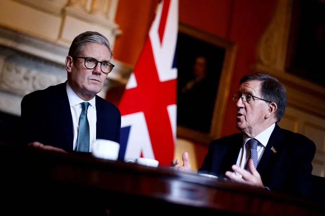FILE PHOTO: Britain's Prime Minister Keir Starmer (L) listens to Member of the House of Lords George Robertson (R) during a joint meeting with Britain's Defence Secretary John Healey (unseen) at 10 Downing Street, in London, on July 16, 2024. BENJAMIN CREMEL/Pool via REUTERS/File Photo