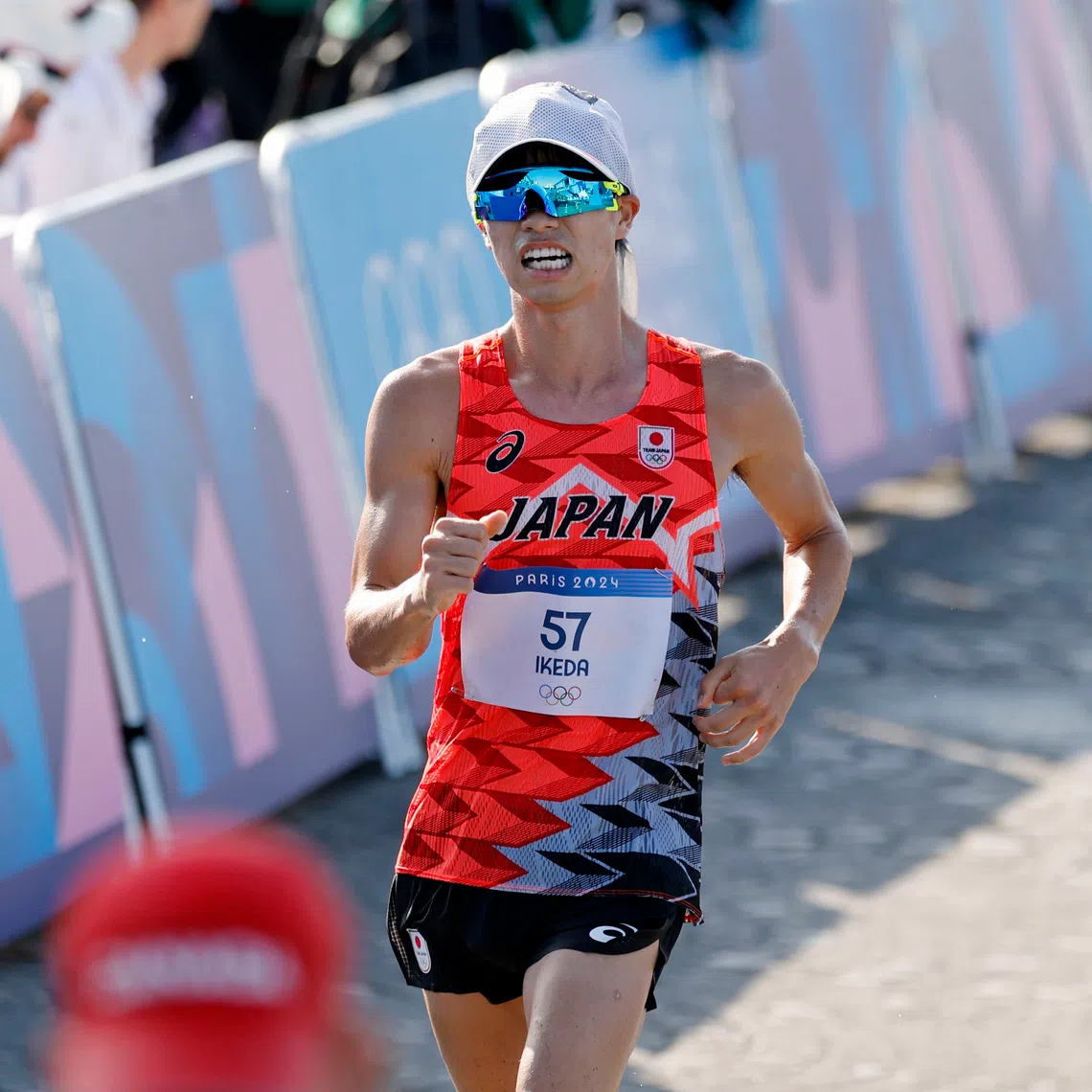 Aug 1, 2024; Paris, France; Koki Ikeda (JPN) competes in the men’s 20km race walk during the Paris 2024 Olympic Summer Games at Pont d'Iéna. Mandatory Credit: Yukihito Taguchi-USA TODAY Sports