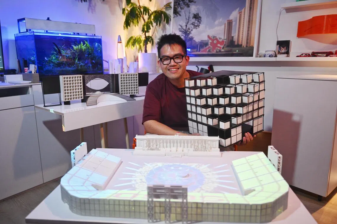ST20250719_202501200845 Azmi Athni kgarchi09//

Architectural assistant Kenneth Chiang, 30, with his NDP stage models in his home on July 19, 2025. 

ST PHOTO: AZMI ATHNI