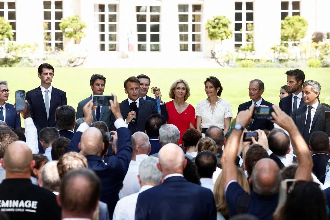 French President Emmanuel Macron meets representatives of stakeholders who contributed to the organising and hosting of the Paris Olympic Games, at the Elysee Palace on Aug 12, 2024.